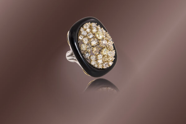 Oro bianco 18 Kt, oro giallo, onice e brillanti